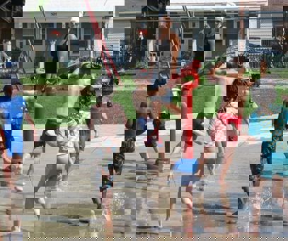 Kids playing in a splash pad.